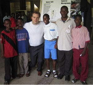 Jim, the founder of Space4Climate, with a group of children